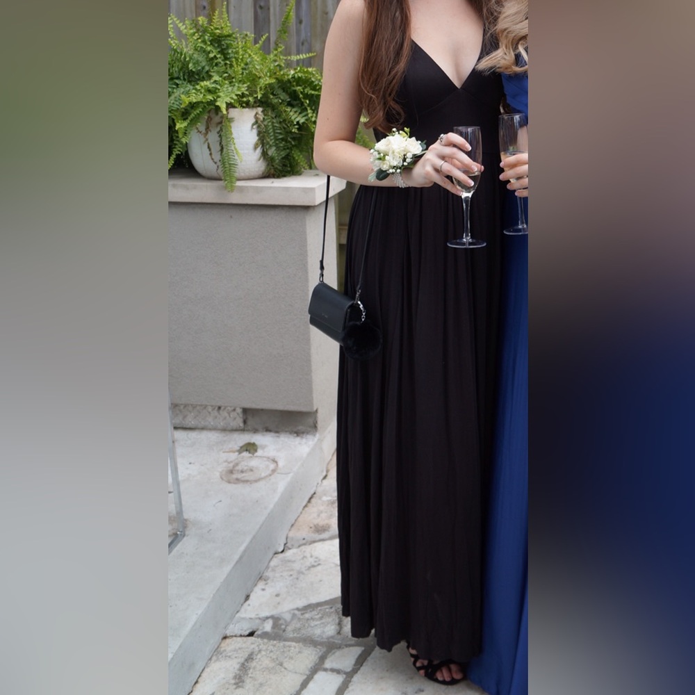 Black floor length dress from Silence + Noise sold at Urban Outfitters.
